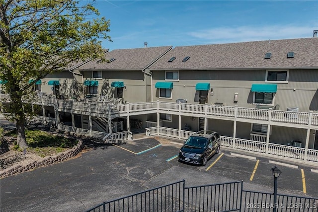 6570 Pelican Dr Unit 404, Osage Beach, MO 65065 - view of property featuring uncovered parking
