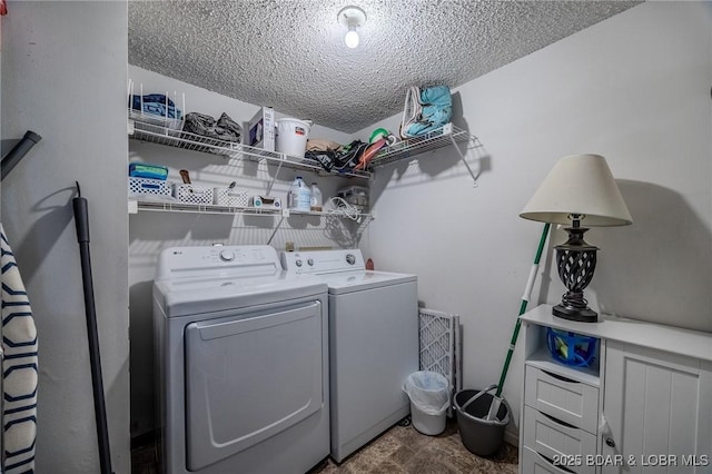 6570 Pelican Dr Unit 404, Osage Beach, MO 65065 - laundry area featuring washer and dryer and a textured ceiling