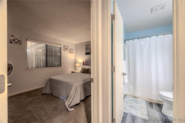 6570 Pelican Dr Unit 404, Osage Beach, MO 65065 - bedroom featuring a textured ceiling and baseboards