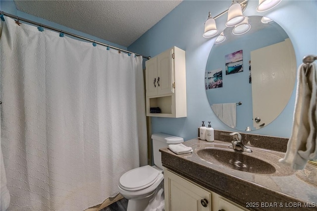 6570 Pelican Dr Unit 404, Osage Beach, MO 65065 - bathroom featuring vanity, toilet, a textured ceiling, and a shower with curtain