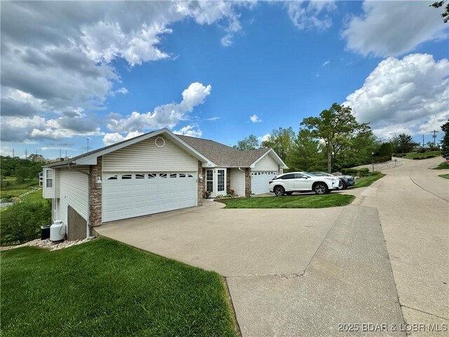 5177 Vicus Castry, Osage Beach, MO 65065 - ranch-style home featuring concrete driveway, a front yard, and a garage
