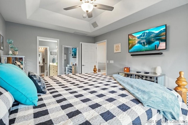 5177 Vicus Castry, Osage Beach, MO 65065 - bedroom featuring a tray ceiling, ensuite bathroom, and ceiling fan