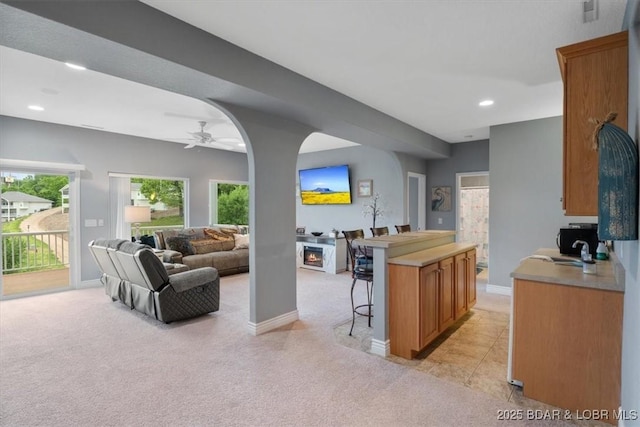 5177 Vicus Castry, Osage Beach, MO 65065 - living room with baseboards, a ceiling fan, recessed lighting, and light colored carpet