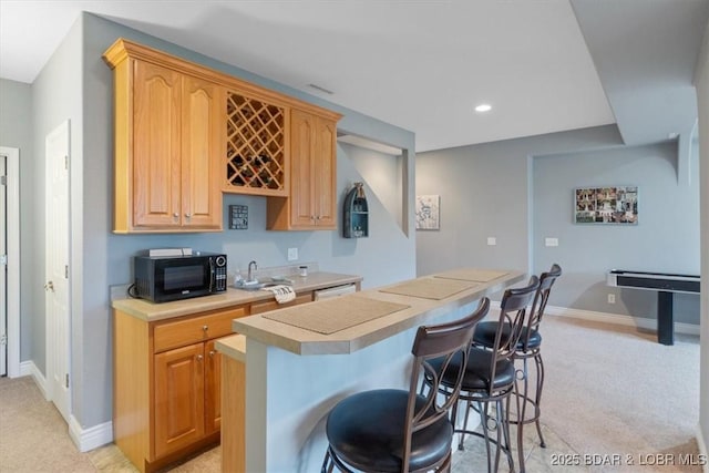 5177 Vicus Castry, Osage Beach, MO 65065 - bar featuring indoor bar, recessed lighting, light carpet, black microwave, and baseboards