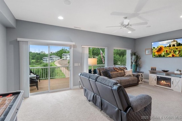 5177 Vicus Castry, Osage Beach, MO 65065 - carpeted living room featuring baseboards, recessed lighting, a glass covered fireplace, and ceiling fan