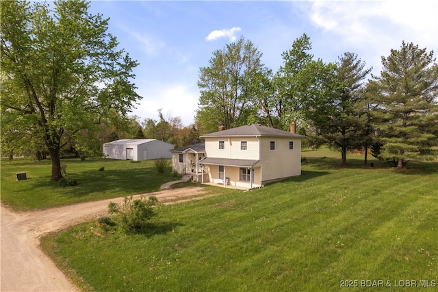 9 Gage Rd, Eldon, MO 65026 - rear view of house with a yard, dirt driveway, and a chimney