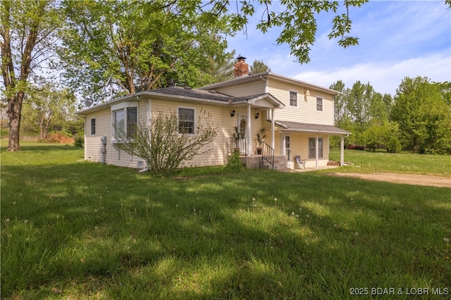 9 Gage Rd, Eldon, MO 65026 - view of front of property with a front lawn, a patio area, and a chimney