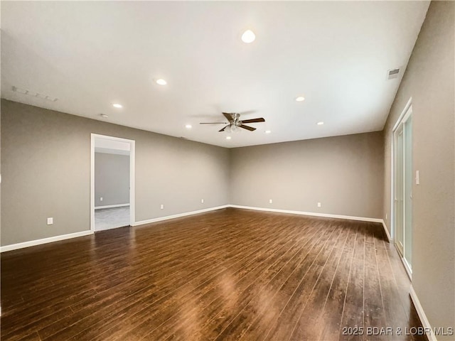 spare room featuring recessed lighting, a ceiling fan, visible vents, baseboards, and wood finished floors