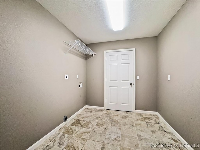 clothes washing area featuring electric dryer hookup, hookup for a washing machine, laundry area, and baseboards