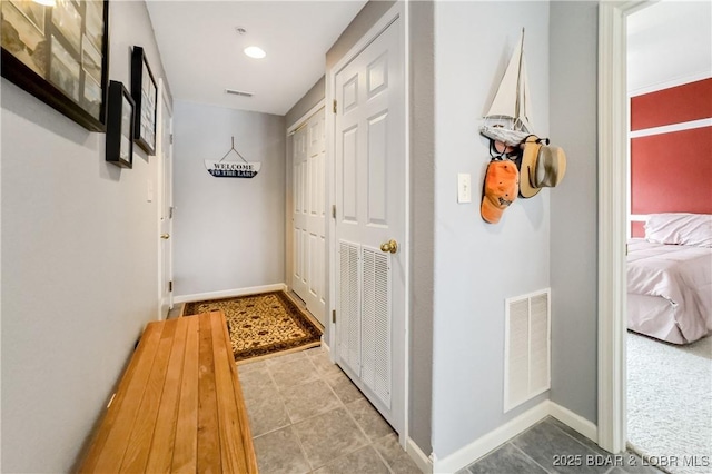 hall with visible vents and recessed lighting