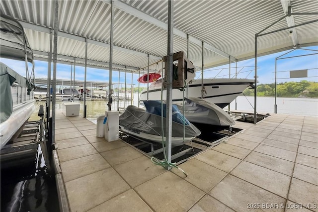 view of dock with a water view and boat lift