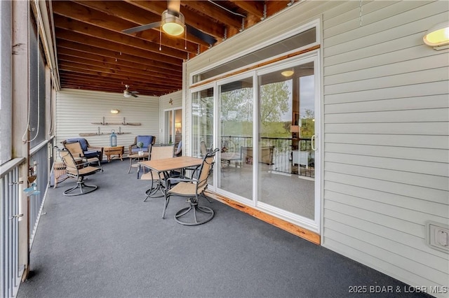 sunroom featuring ceiling fan