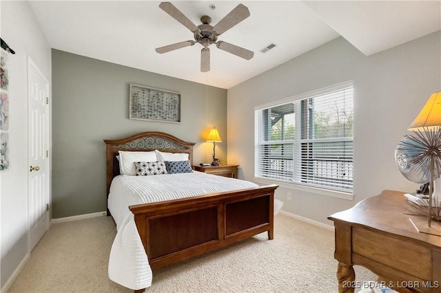 bedroom with light colored carpet, visible vents, ceiling fan, and baseboards