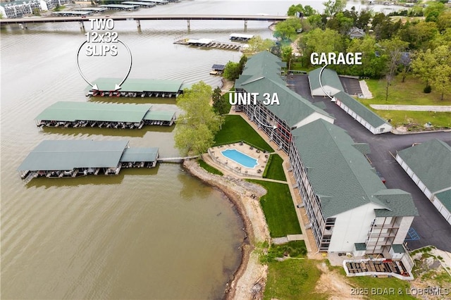 birds eye view of property featuring a water view