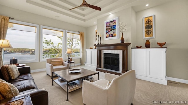 living area with light colored carpet, recessed lighting, ceiling fan, and a tile fireplace