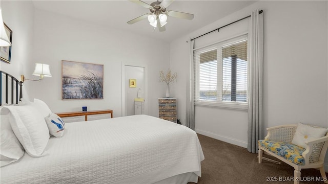 carpeted bedroom featuring a ceiling fan and baseboards