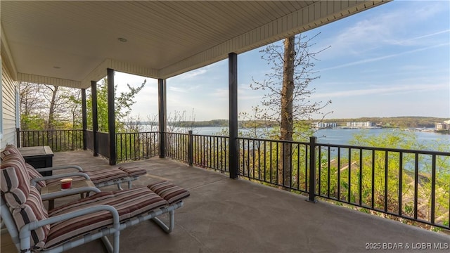 view of patio featuring a water view