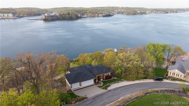 birds eye view of property with a water view