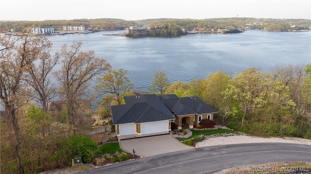 drone / aerial view with a water view