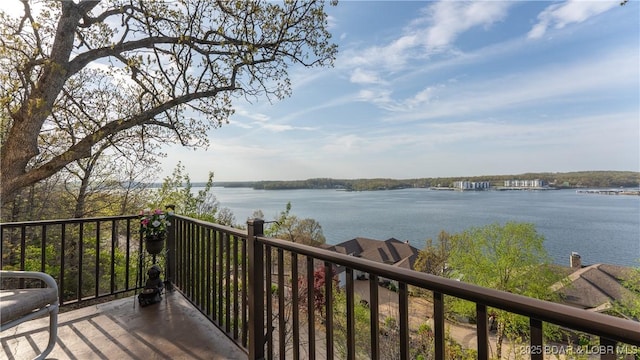 wooden deck featuring a water view