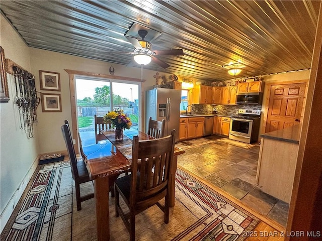 69985 US Highway 50, Tipton, MO 65081 - dining space with a ceiling fan, wooden ceiling, and stone tile floors