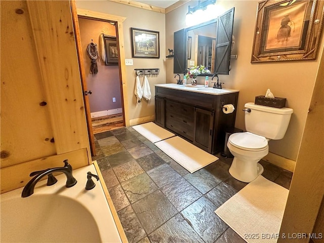 69985 US Highway 50, Tipton, MO 65081 - full bath featuring double vanity, stone tile flooring, and a tub