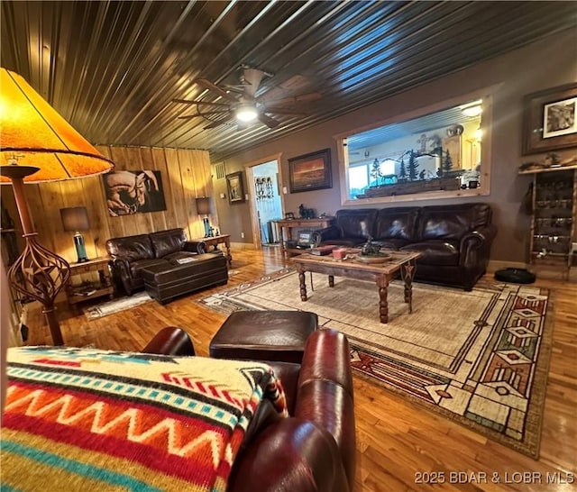 69985 US Highway 50, Tipton, MO 65081 - living area with wood finished floors, ceiling fan, and wooden walls