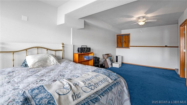 bedroom with a ceiling fan, carpet flooring, and baseboards