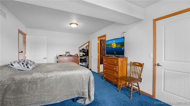 bedroom with baseboards, visible vents, and carpet flooring