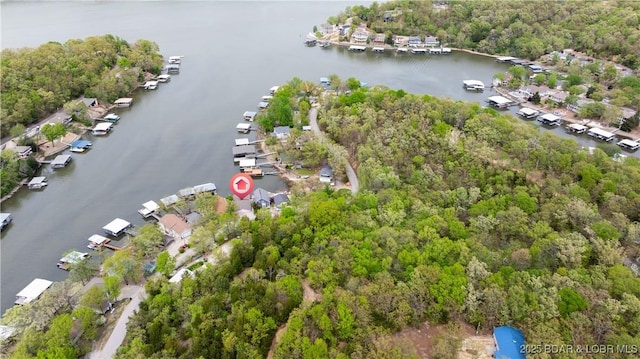 drone / aerial view featuring a residential view and a water view