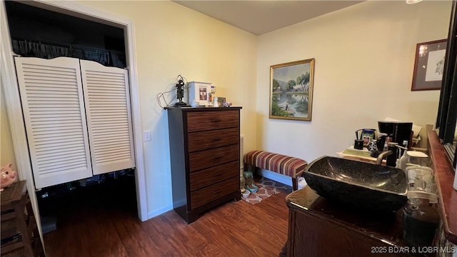30993 Viewside Dr, Rocky Mount, MO 65072 - bedroom featuring a closet, baseboards, and dark wood-type flooring