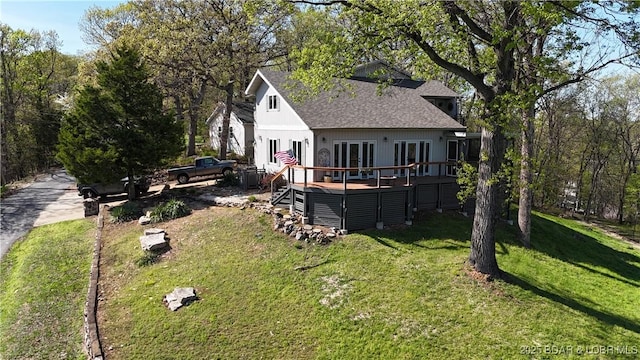 30993 Viewside Dr, Rocky Mount, MO 65072 - rear view of house featuring french doors, a wooden deck, a yard, and roof with shingles