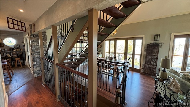 30993 Viewside Dr, Rocky Mount, MO 65072 - staircase with a high ceiling, a wealth of natural light, and wood finished floors