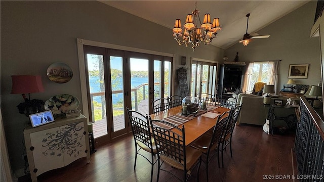 30993 Viewside Dr, Rocky Mount, MO 65072 - dining space with high vaulted ceiling, wood finished floors, ceiling fan with notable chandelier, and a water view