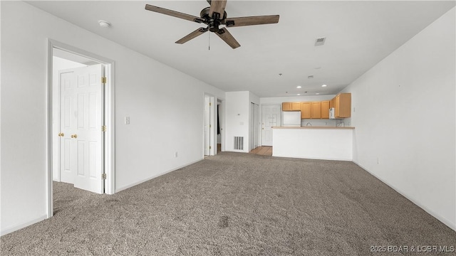 unfurnished living room with visible vents, a ceiling fan, light colored carpet, and recessed lighting