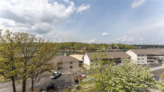 drone / aerial view with a residential view and a water view