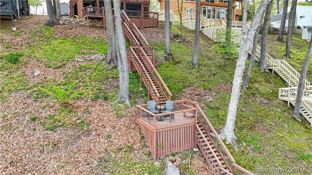view of yard with a wooden deck and stairway