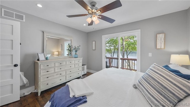 bedroom featuring dark wood-style flooring, ceiling fan, access to exterior, visible vents, and baseboards