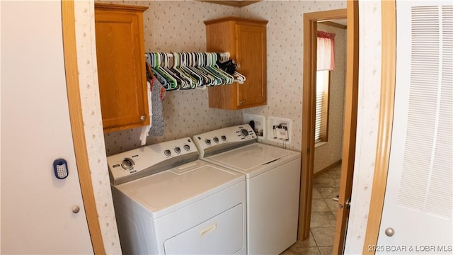 laundry area with independent washer and dryer, a heating unit, wallpapered walls, and cabinet space