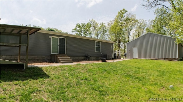 rear view of house featuring a yard