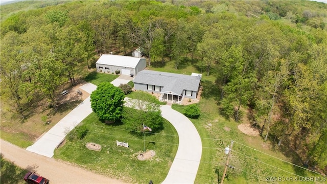 drone / aerial view with a view of trees