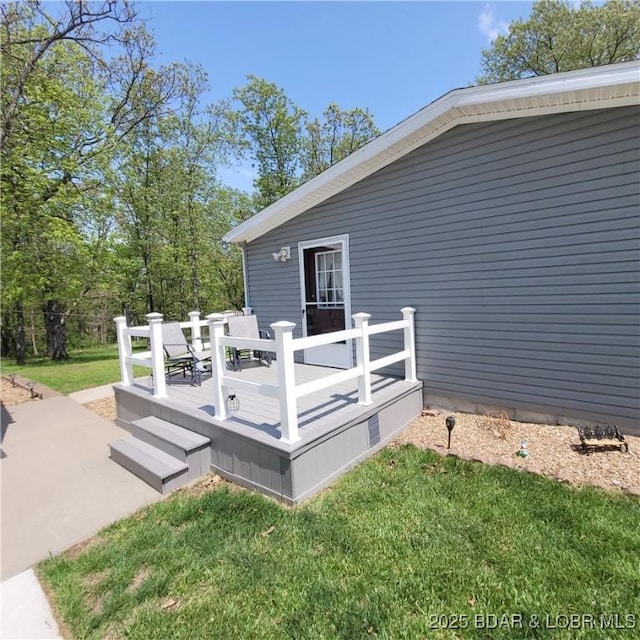 deck featuring a lawn