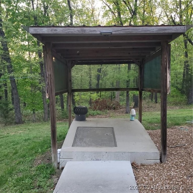 entry to storm shelter featuring a yard