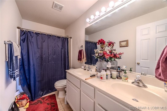 full bathroom featuring double vanity, visible vents, tile patterned flooring, a sink, and toilet