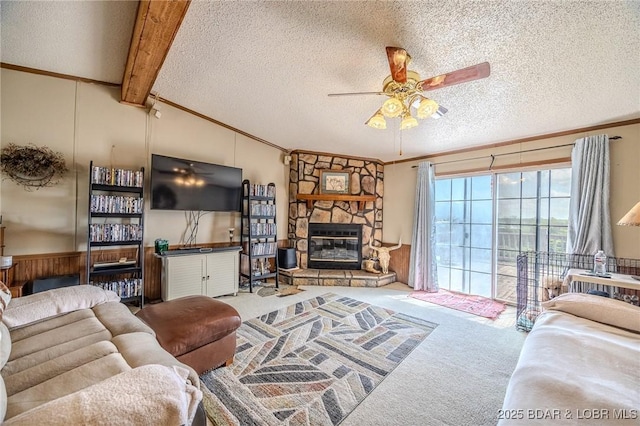 122 Simpson Rd, Urbana, MO 65767 - living area featuring ornamental molding, ceiling fan, lofted ceiling with beams, a textured ceiling, and carpet flooring
