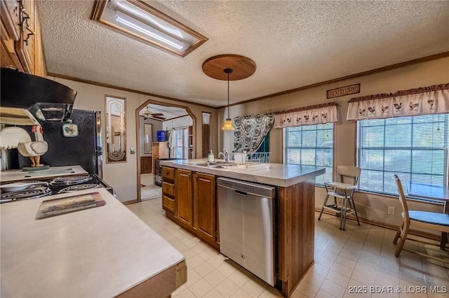 122 Simpson Rd, Urbana, MO 65767 - kitchen with a kitchen island with sink, brown cabinetry, a textured ceiling, dishwasher, and ornamental molding