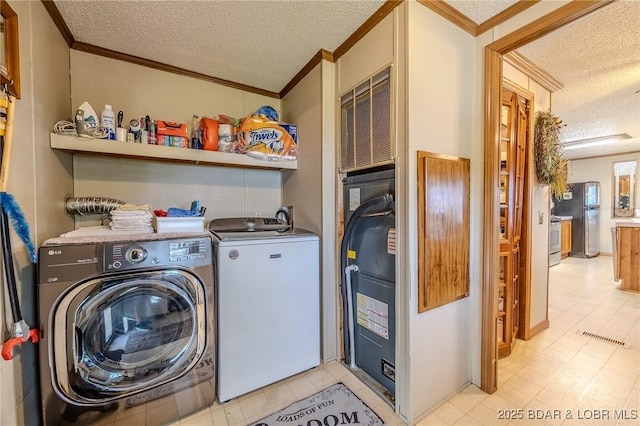 122 Simpson Rd, Urbana, MO 65767 - washroom featuring laundry area, a textured ceiling, visible vents, crown molding, and separate washer and dryer