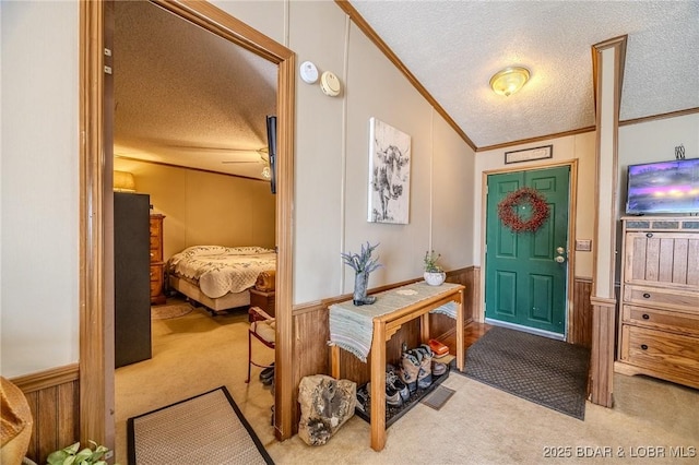 122 Simpson Rd, Urbana, MO 65767 - foyer featuring a wainscoted wall, ornamental molding, carpet, and a textured ceiling