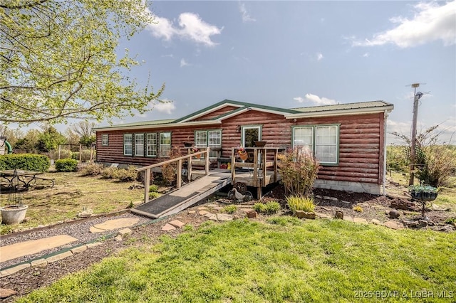122 Simpson Rd, Urbana, MO 65767 - rear view of property featuring faux log siding, a yard, a deck, and metal roof