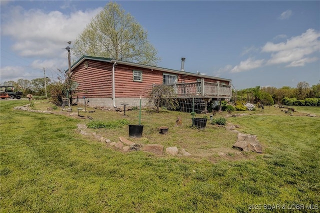122 Simpson Rd, Urbana, MO 65767 - rear view of house featuring a lawn, a wooden deck, and faux log siding